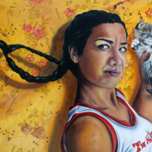 Heidi Pitre oil painting on panel of a girl in a twister ringer t shirt in front of a floral wallpaper holding a kitten with flying braids