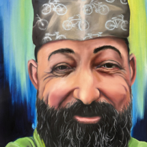 Heidi Pitre oil painting on panel of a bearded man wearing a green shirt wearing a paper hat with bicycles on it.