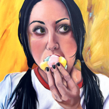 Heidi Pitre oil painting on panel of a girl with black hair in pigtails shoving multicolored marshmallows in her mouth, wearing a ringer t shirt.